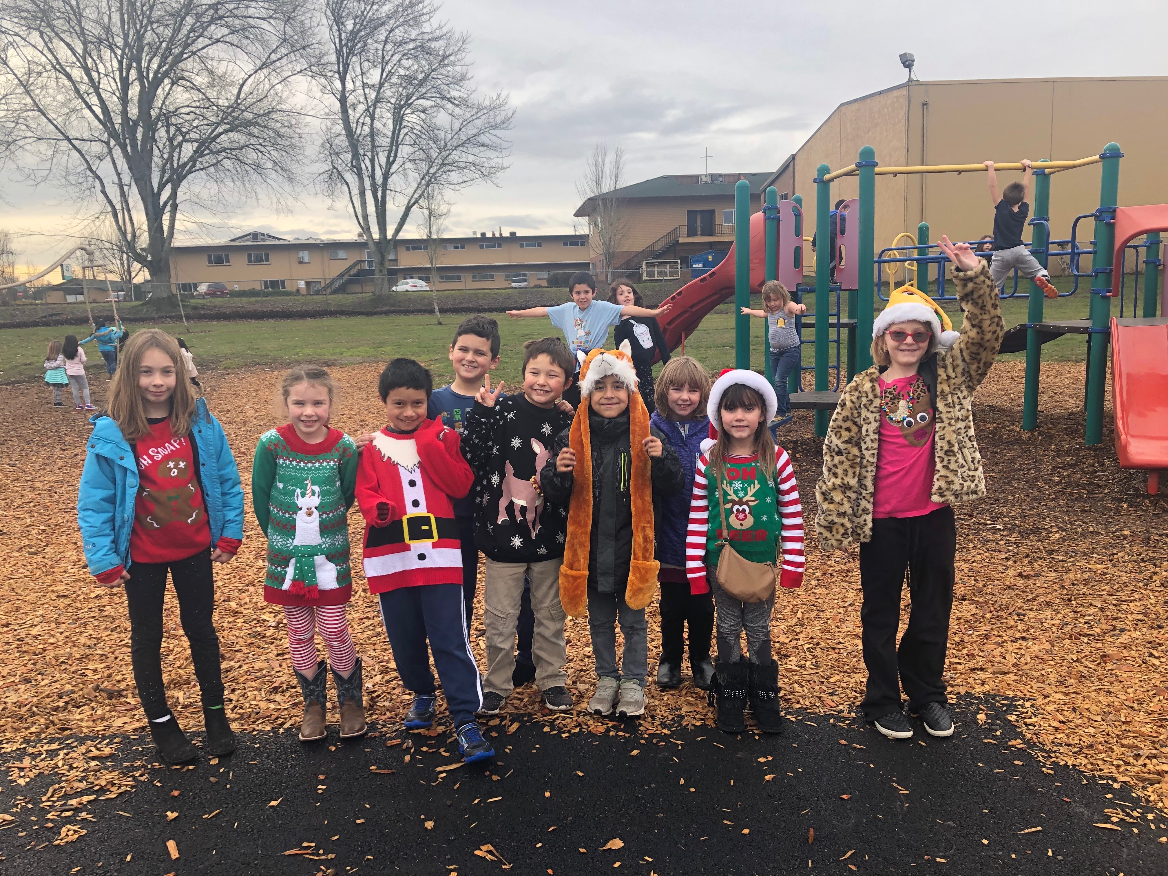 Students on playground in ugly sweaters